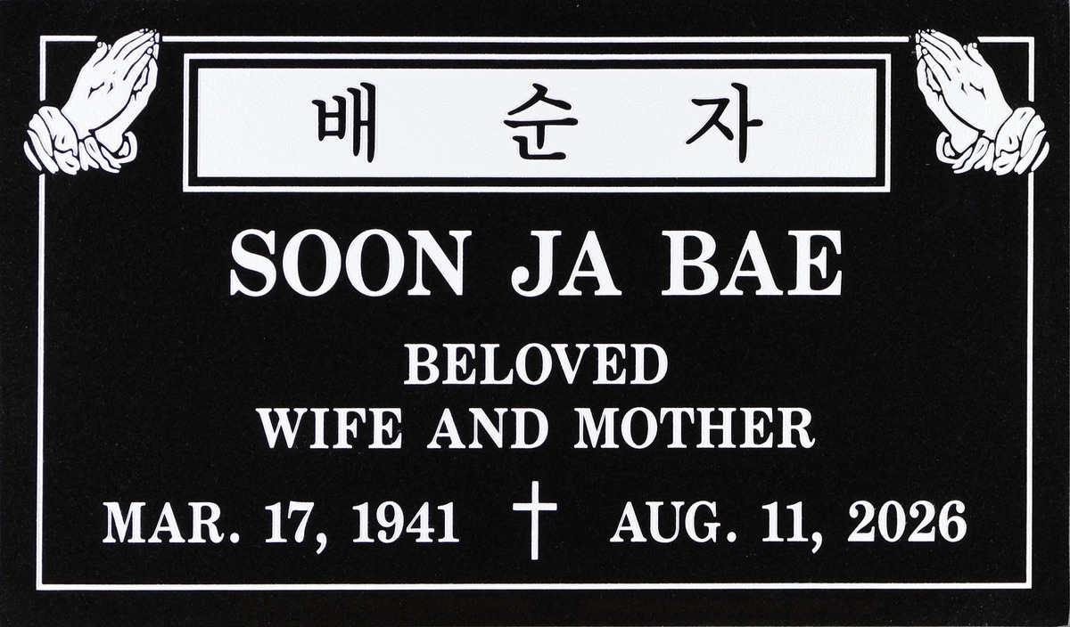 Black granite grave stone with praying hands and cross, Bae family, Rose Hills Memorial Park