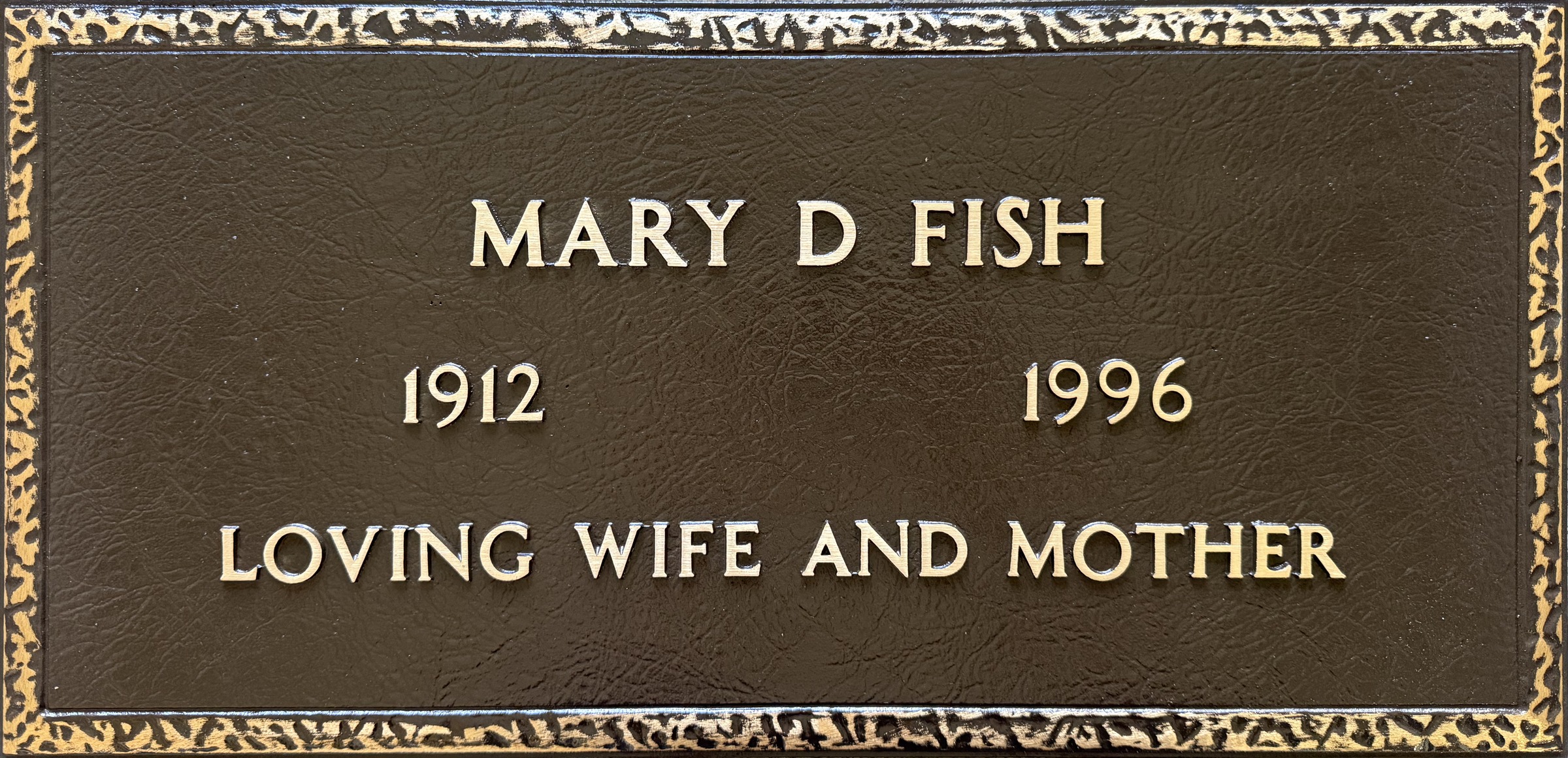 Bronze grave stone with textured border, Fish family, Oak Park Cemetery