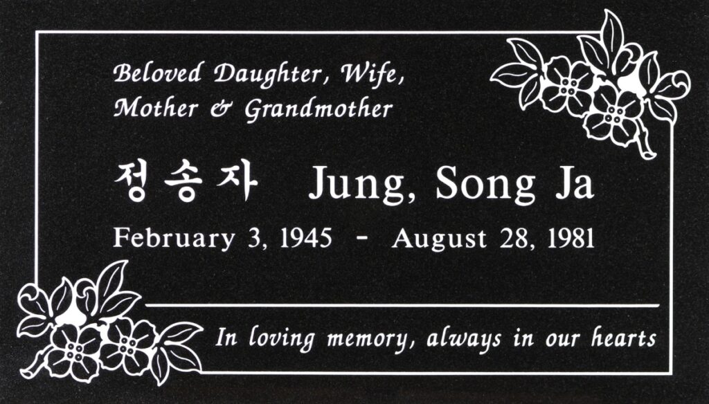 Black granite headstone with dogwood flowers, Jung family, Rose Hills Memorial Park