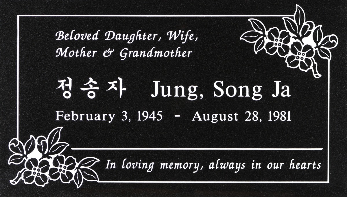 Black granite headstone with dogwood flowers, Jung family, Rose Hills Memorial Park
