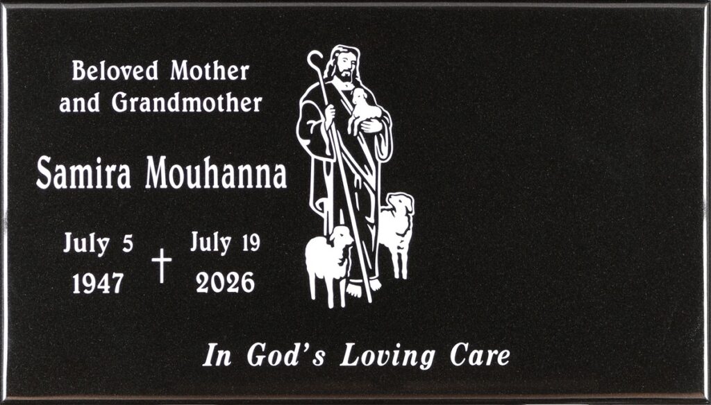 Black granite gravestone with good shepherd and lambs, Mouhanna family, Holy Cross Cemetery