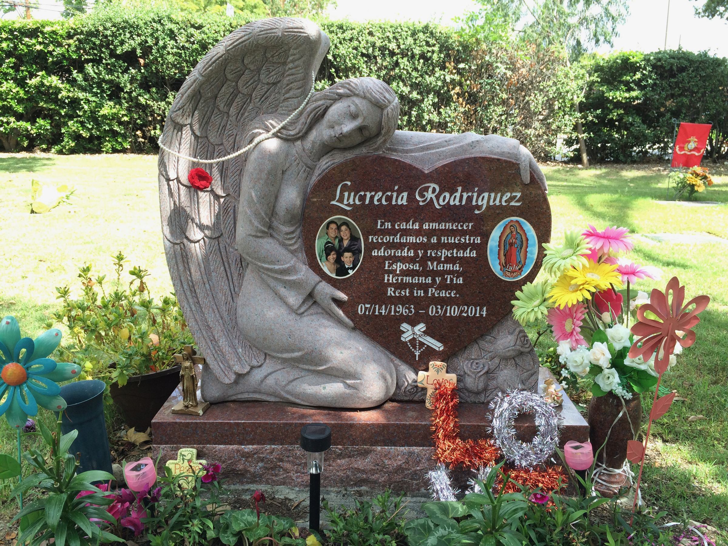 Sentinel Red granite upright monument with kneeling angel heart, Rodriguez family, Bellevue Memorial Park