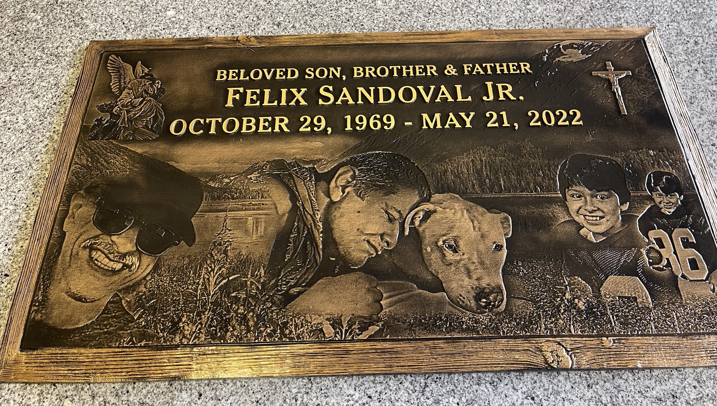 Bronze memorial stone with portraits and dog, Sandoval family, Resurrection Cemetery